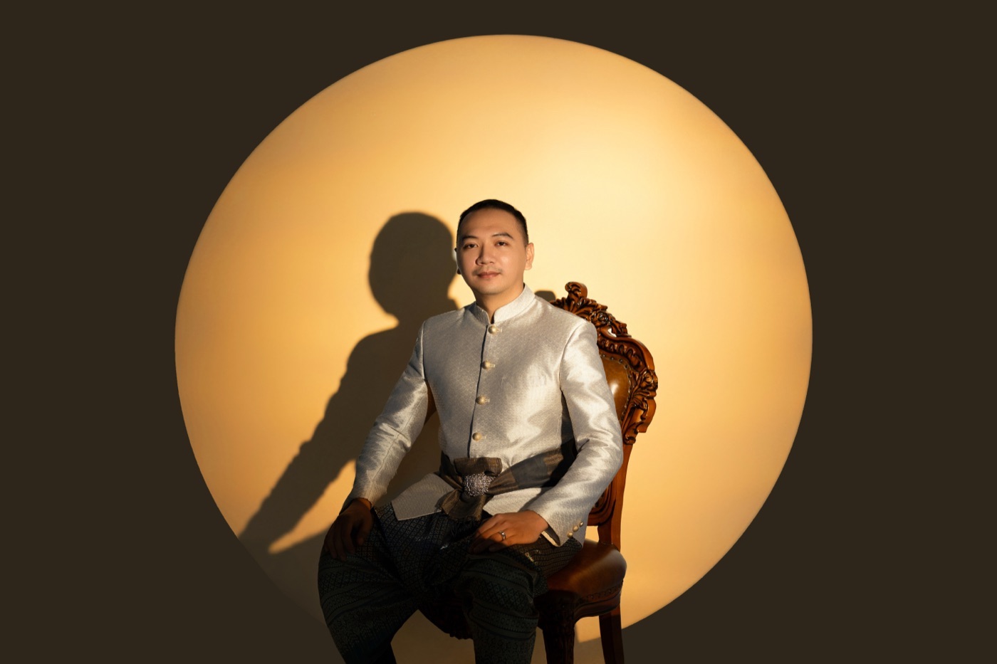 The groom, lit by a single circle